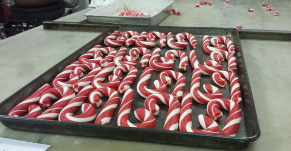 A tray of fresh, hand-pulled candy canes cools as they await packaging.