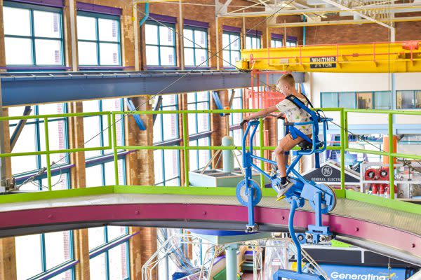 Young boy riding the high rail bike at Science Central in Fort Wayne, Indiana