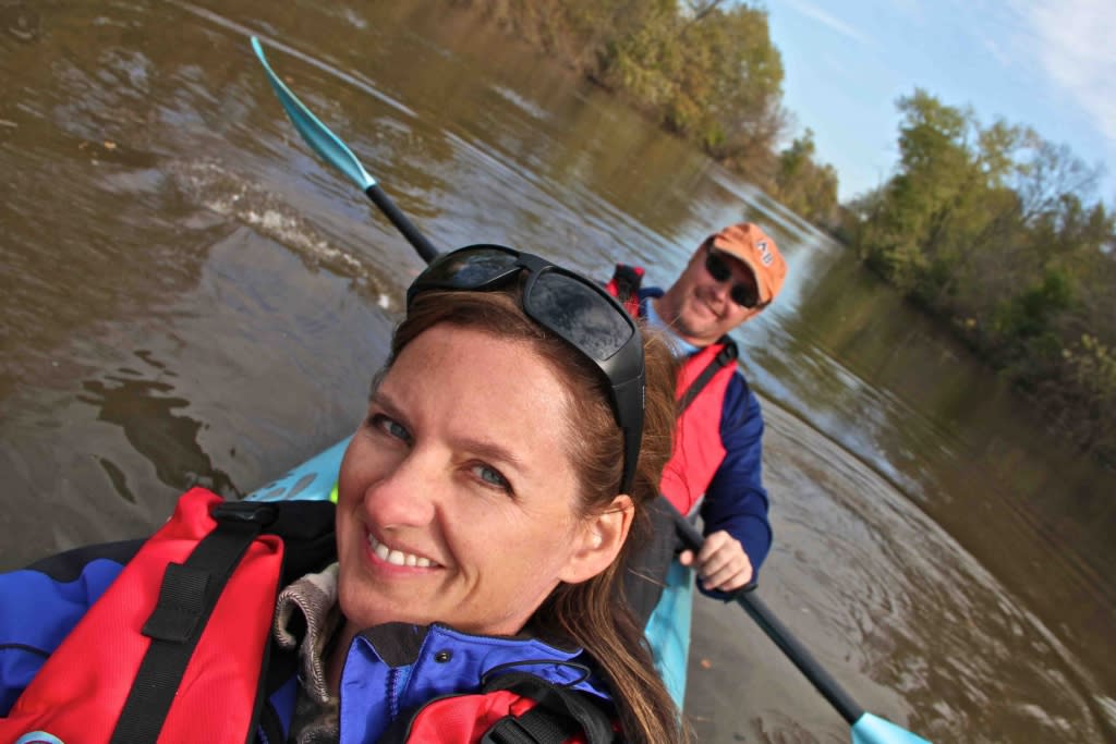 a couple in a tandem kayak