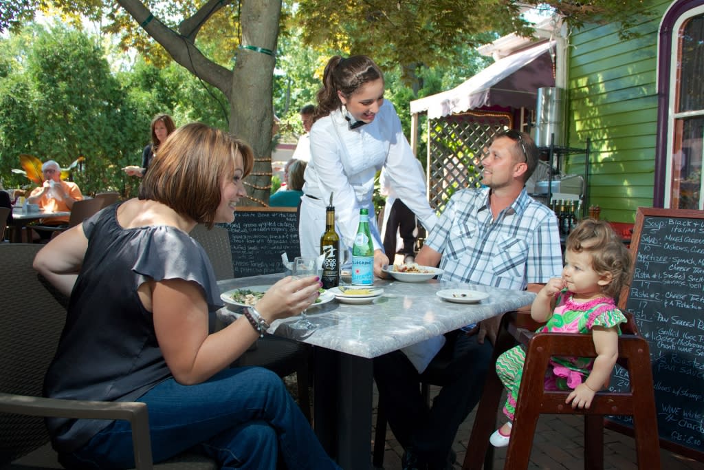 Family eating outdoors at a restaurant