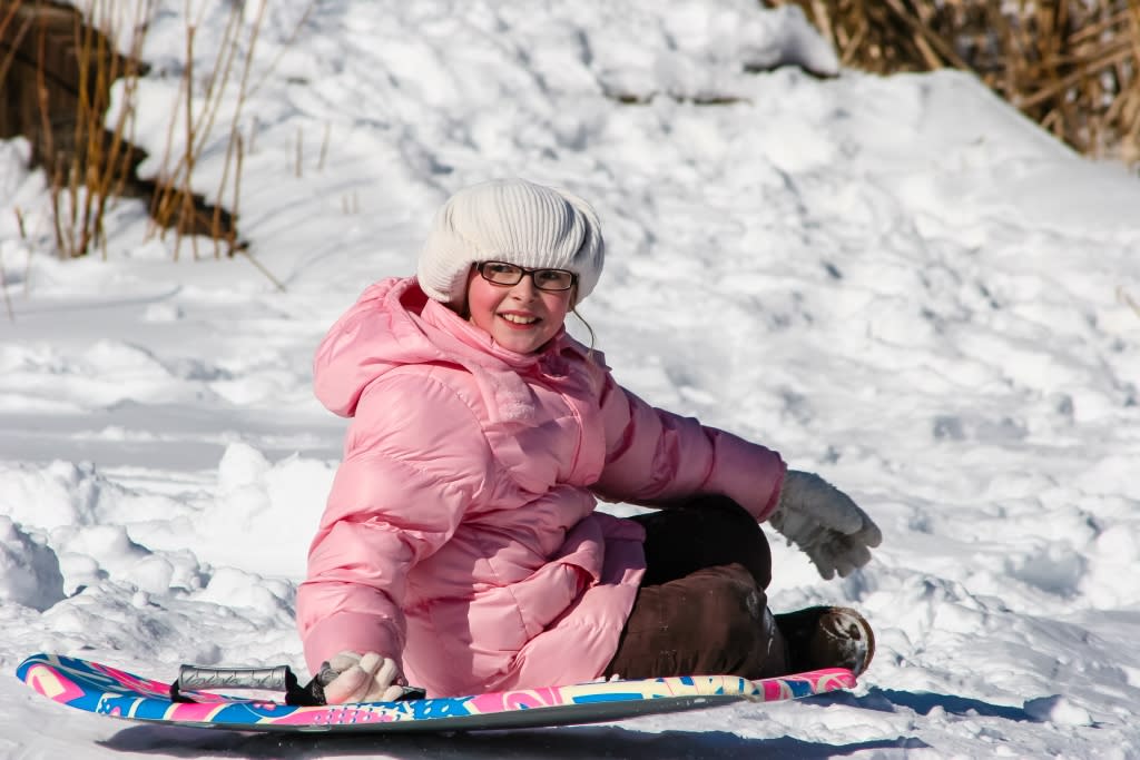 Girl sledding