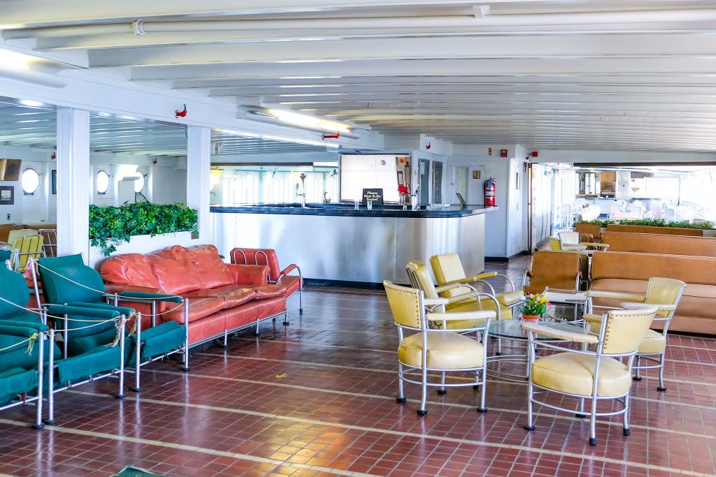 brightly colored art deco furniture in lounge of historic great lakes passenger ship museum