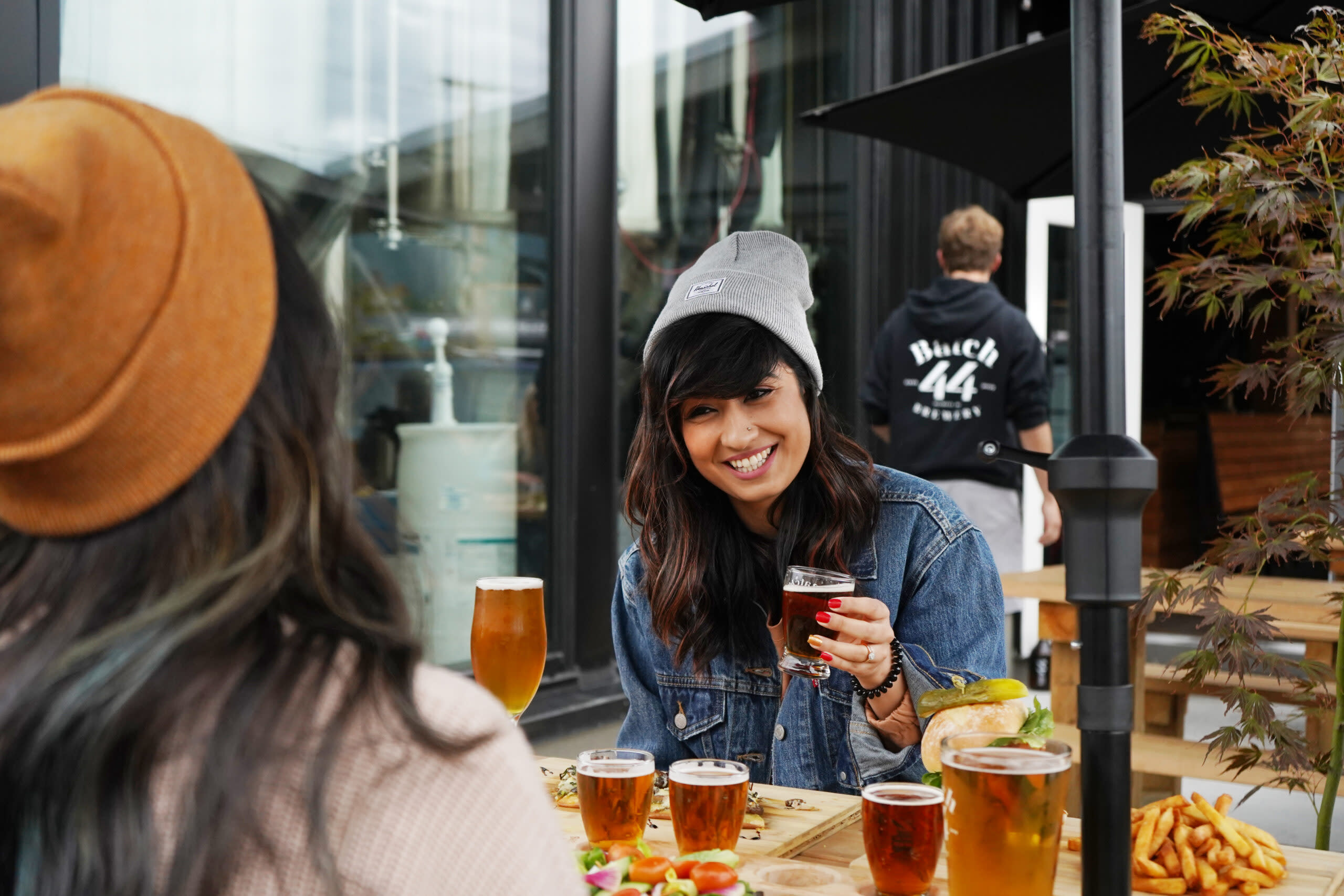 Two friends enjoy a flight of beer at Batch 44 Brewery in Sechelt. Photo by Geoff Tomlin-Hood