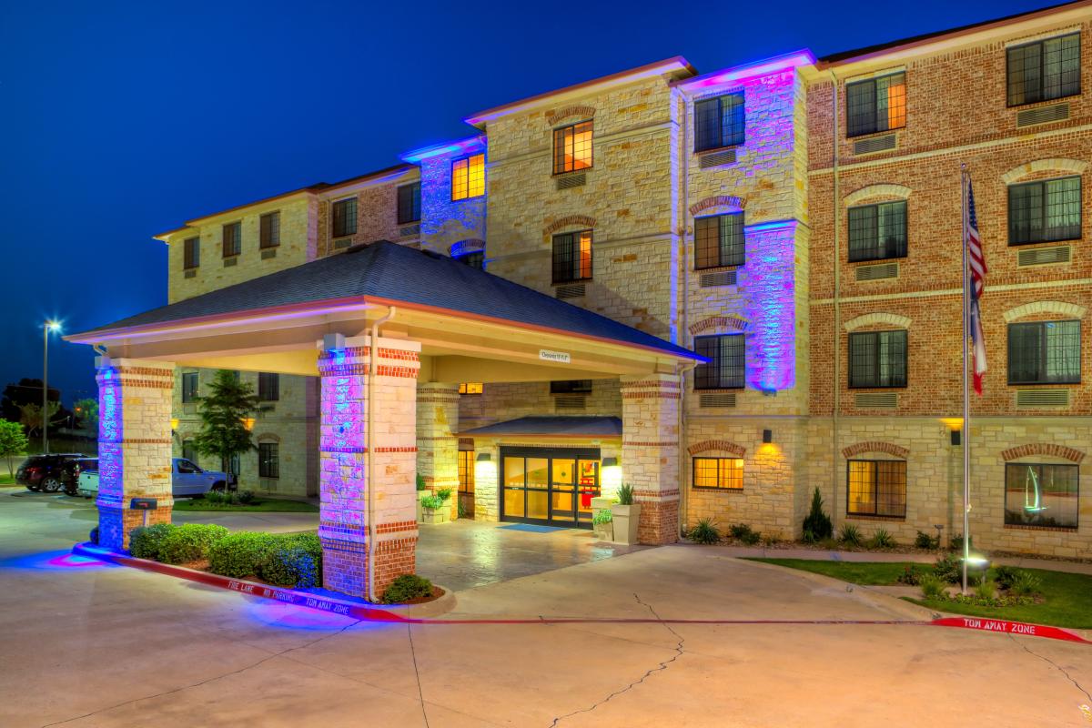 Granbury features a heated indoor pool and hot tub, a fitness center, fully...