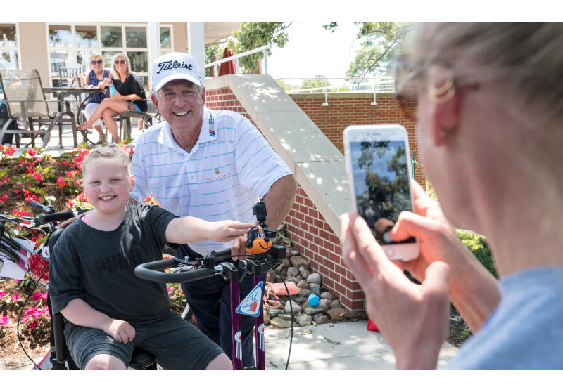 Jay Haas and young bike recipient at 2017 Principal Charity Classic