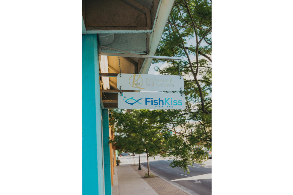 Fish Kiss Sign and Front of Building