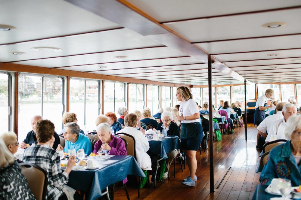Waitress taking drink orders on board the Grand Belle of Geneva on Lake Geneva