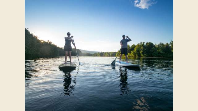 Couple paddle boarding on Beaver Creek