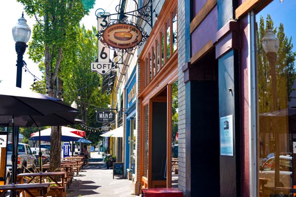 Main Street storefronts and outdoor seating near Plank Town in Springfield
