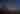 desert landscape with a saguaro cactus, desert brush, and a night sky filled with stars