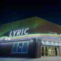 Exterior of Lyric Theater at night.