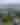 View of town of Haines from mountain top, girl over looking
