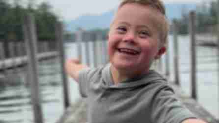 Portrait of Hudson Droubay smiling with the Adirondack Mountains in the background