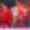 Taylor Swift during the Eras Tour with backup dancers in red clothing