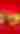 Four gourmet burgers with various toppings, including lettuce, cheese, and bacon, arranged on a vibrant red background with fries scattered around.