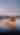 Two people canoeing on an inland lake