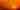Silhouettes of birds in front of an orange-red sky and a white, setting sun