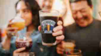 People enjoying beverages on the brewgrass trail