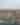 aerial of a snowy small hillside town