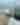 White car on the beach with a parking pass on the window for 2024