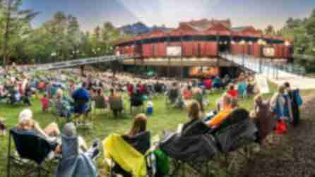 People in lawn chairs gather for a performance at the Saratoga Performing Art Center