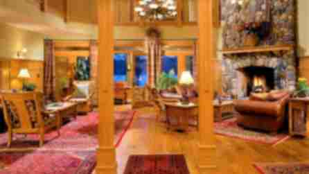 Cozy sitting room with a stone fireplace at the Fern Lodge