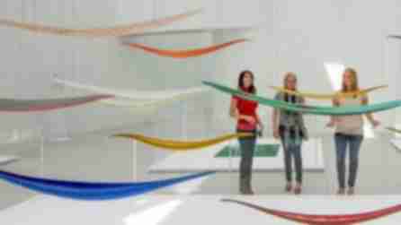 People enjoying exhibits at the Corning Museum of Glass