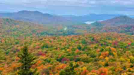 View of colorful fall foliage in the Adirondacks from Coney Mountain in Tupper Lake
