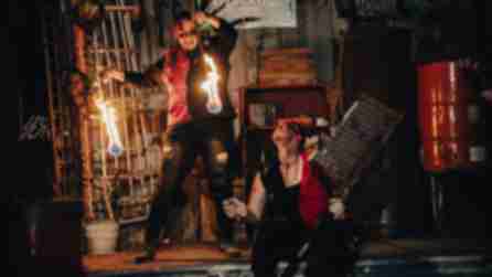 Two performers put on a fire show on the Chaos Midway at Frightmare Farms.