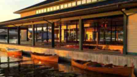 Three canoes docked at sunset at the Antique Boat Museum in Clayton, NY.