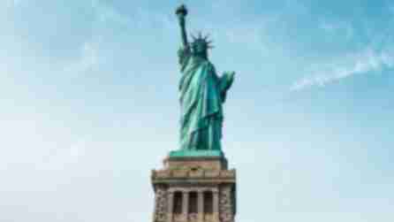 The Statue of Liberty in front of a blue sky