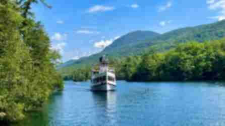 cruise boat gliding along lake