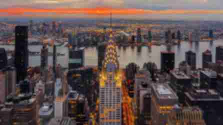 The Chrysler Building in Manhattan, the East River and Queens during sunrise viewed from The Summit at One Vanderbilt.