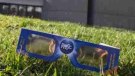 Eclipse viewing glasses on the lawn in front of the RMSC