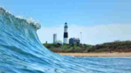 Waves crest in front of the beaches of the Montauk Lighthosue