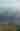 Landscape of green hills and fog