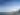 A skyline of downtown Corpus Christi on the ocean with a sail boat.