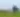 Two men fire a cannon at Fort Larned