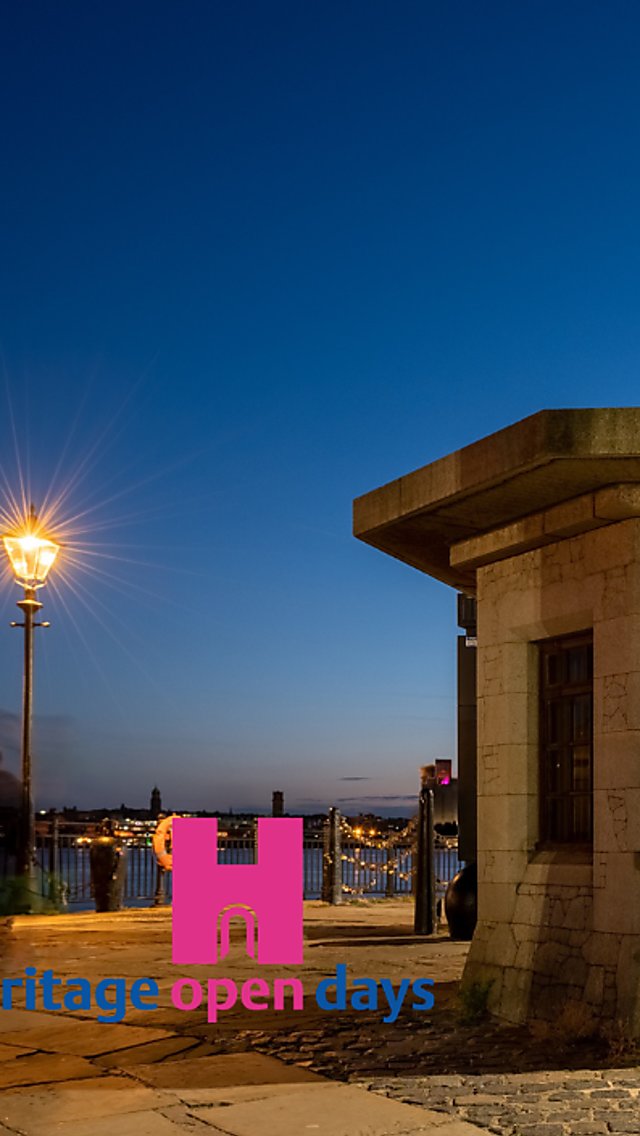 A little brick house on Royal Albert Dock at night