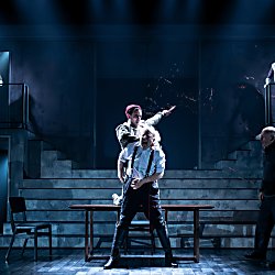 Actors in a modern adaptation of Macbeth