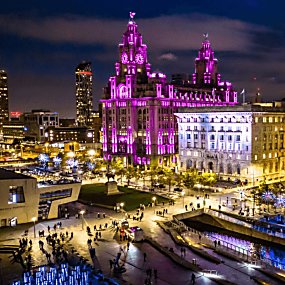 Liverpool Pier Head at night, with light artworks lit up