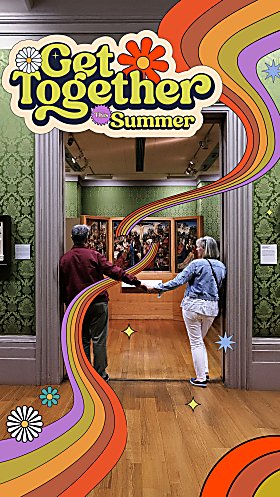 Two people holding hands and walking through a door at a museum.