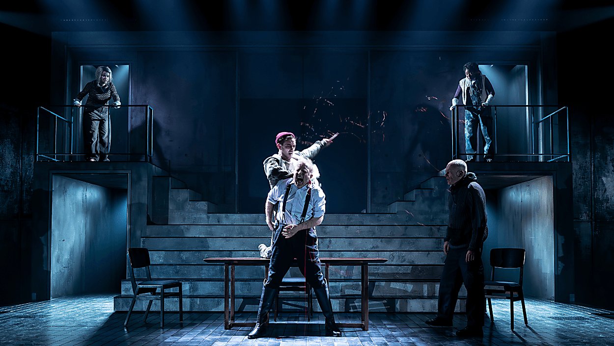 Actors in a modern adaptation of Macbeth