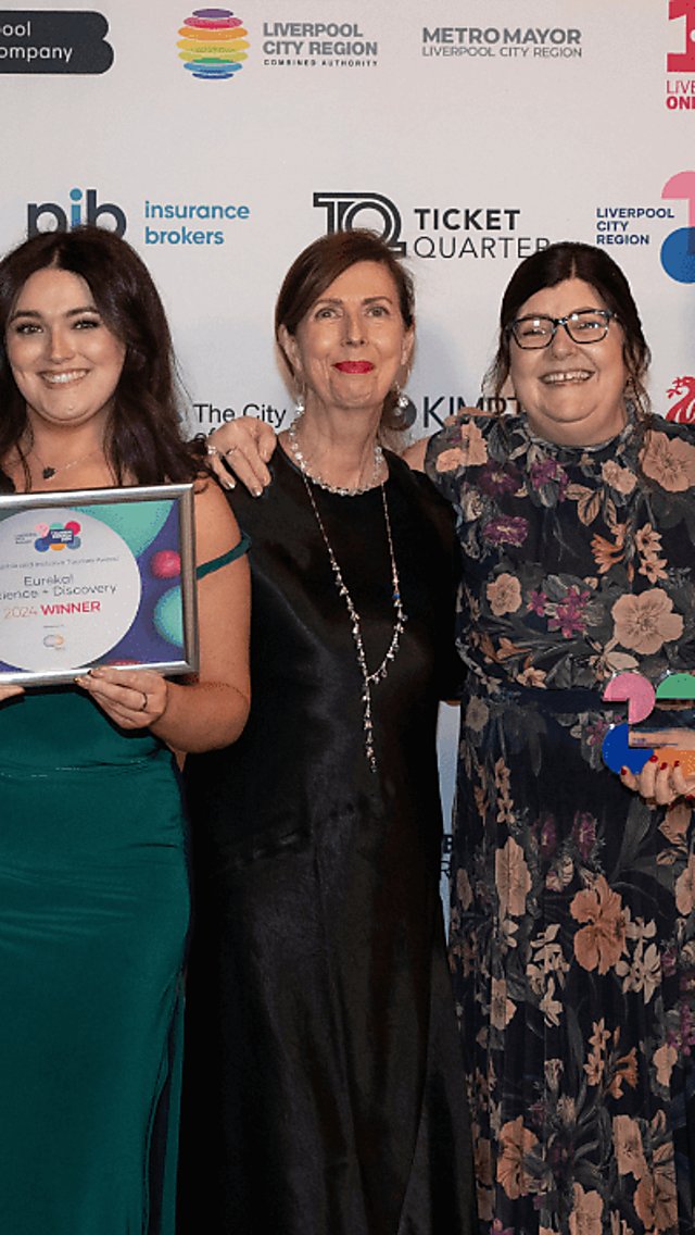 People standing holding an award at the LCR Tourism Awards