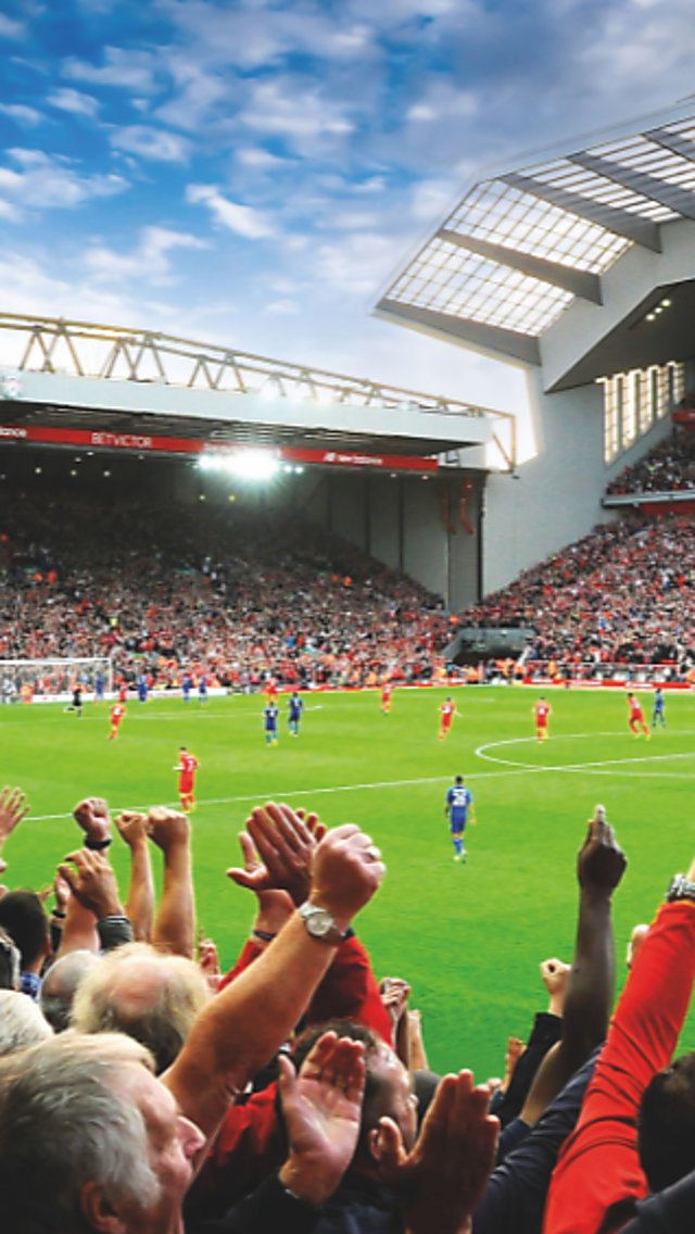 People wathing a football match at Anfield