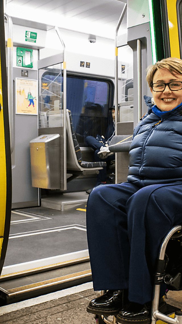 Tanni Grey-Thompson outside Meseyrail 777 train