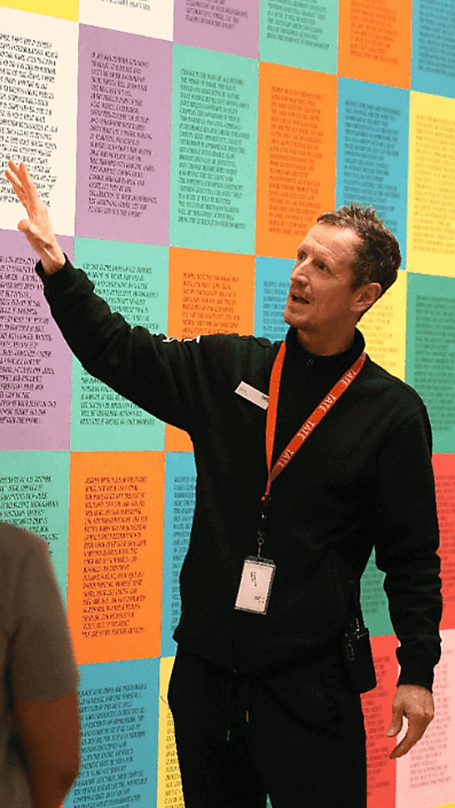 People standing inside Tate Liverpool
