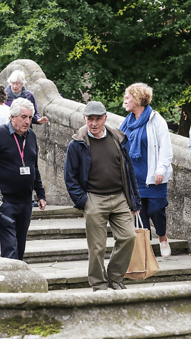 A group of older people on tour of Port Sunlight