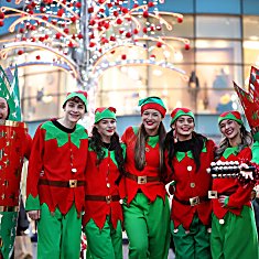 Eight people dressed as elves and Christmas crackers stood outside John Lewis in Liverpool ONE.