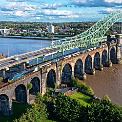 An Avanti West Coast train going under the Runcorn Bridge